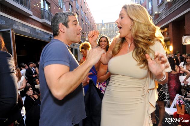 Andy Cohen and Mary Amons share an impromptu dance on Bethesda Row's runway.